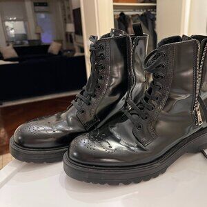 Prada lace up-compat boots with side zippers, chunky sole, and brogue toe